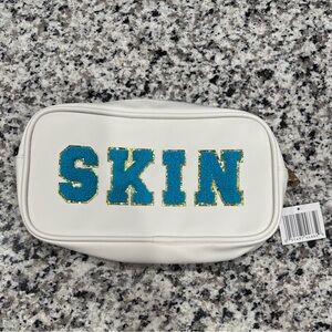 White Pouch with Blue and Gold 'SKIN' Design